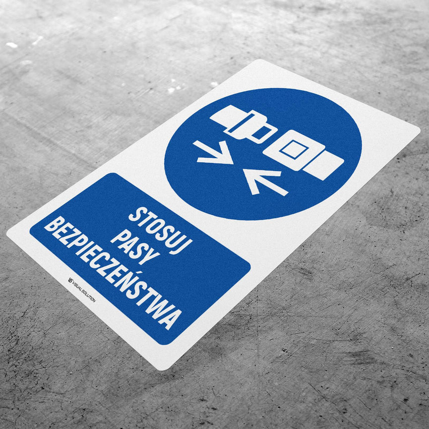 Naklejka podłogowa BHP: Nakaz stosowania pasów bezpieczeństwa z opisem.